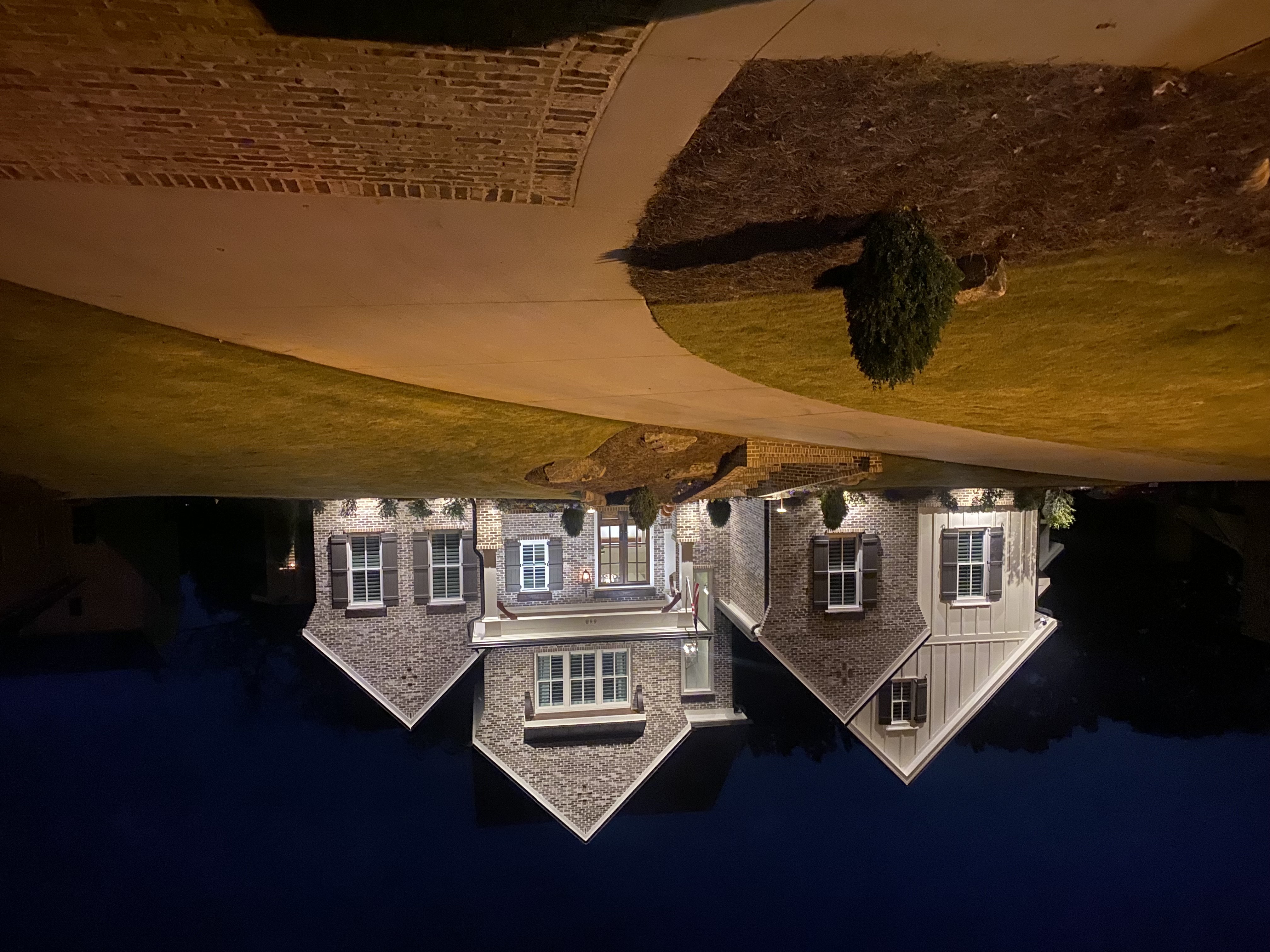house at night with a sky reflection